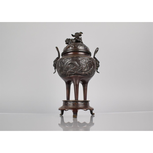 178 - A Japanese Bronze Koro of Squat Bellied Form, Raised on Tapering Tripod Supports and Circular Base. ... 