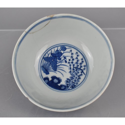 30 - A Chinese Porcelain Blue and White Bowl decorated with River Village Scene and Central Bird in Branc... 