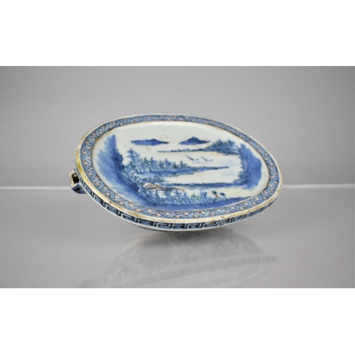 62 - A Chinese Porcelain Warmer Dish of Oval Form Decorated in Underglaze Blue and White with River Villa... 