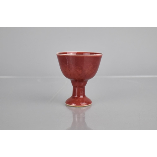 112 - A Chinese Porcelain Sang De Boeuf Stem Cup with Six Character Mark to base, 6.5cm high