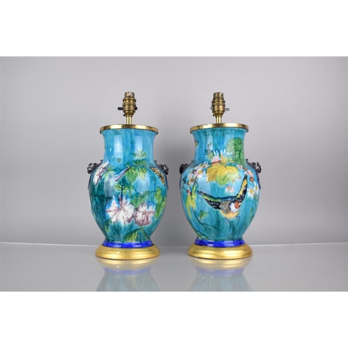 307 - A Pair of French Majolica Lamps of Baluster Form decorated with Flowers, Birds and Butterflies on Bl... 