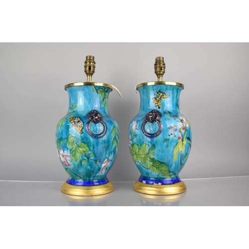 307 - A Pair of French Majolica Lamps of Baluster Form decorated with Flowers, Birds and Butterflies on Bl... 