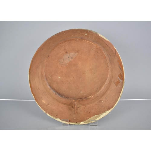 306 - A Terracotta Charger Decorated in Slip Glaze with Thistle Type Plants to Centre and Geometric Trim, ... 