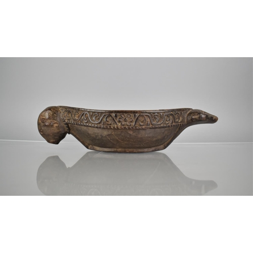 265 - A Carved Wooden Water Drinking Bowl of Kharal Form , Boat Shaped with Buffalo Handle and Muridae Pou... 