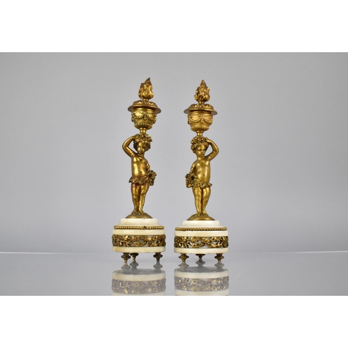 222 - A Pair of French Gilt Bronze and Marble Candlesticks Modelled as Cherubs Supporting Urns having Horn... 