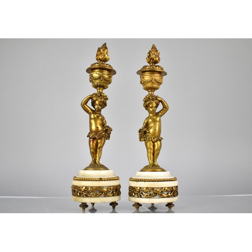 222 - A Pair of French Gilt Bronze and Marble Candlesticks Modelled as Cherubs Supporting Urns having Horn... 