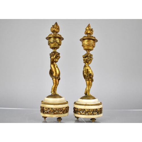 222 - A Pair of French Gilt Bronze and Marble Candlesticks Modelled as Cherubs Supporting Urns having Horn... 