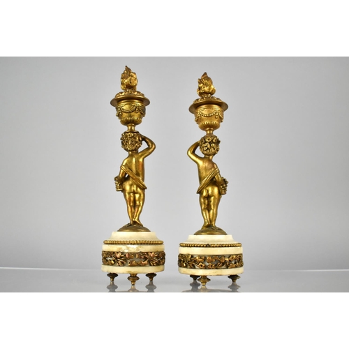 222 - A Pair of French Gilt Bronze and Marble Candlesticks Modelled as Cherubs Supporting Urns having Horn... 