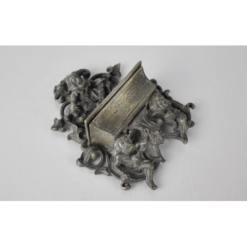 236 - A Cast Metal Wall Mounting Match Holder with Scrolled and Pierced Back with Gnomes, 10x13cms High