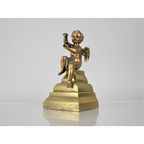 239 - A Polished Bronze Cherub in Seated Position, Lozenge Mark to Base, Mounted on Tapering Base, 18cms H... 