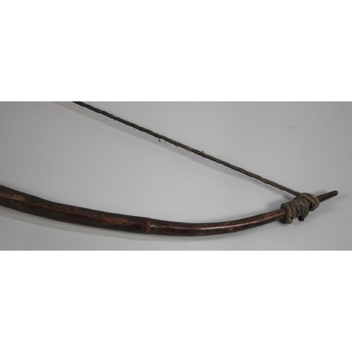 247 - A 19th Century Tribal/Aboriginal Bow, 50cms Long