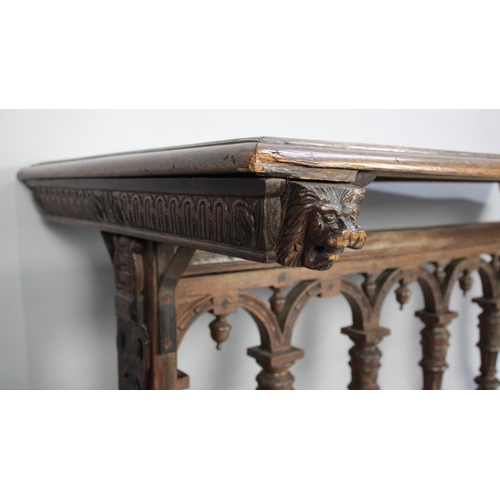 360 - A Gothic Oak Side Table with Carved Decoration, 174x75x82cm high