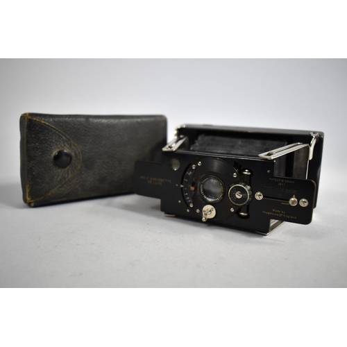 25 - An Early 20th Century Folding Camera, No. 2 Z Ensignette Deluxe Made by Houghtons, London, Patent 19... 