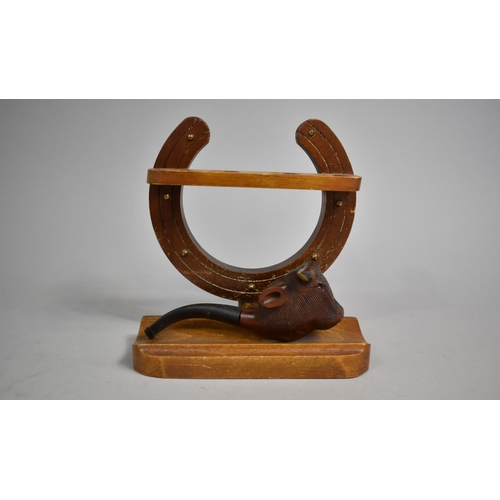 39 - A Mid 20th Century Pipe Rack in the Form of Horseshoe Containing One Carved Bull's Head Pipe