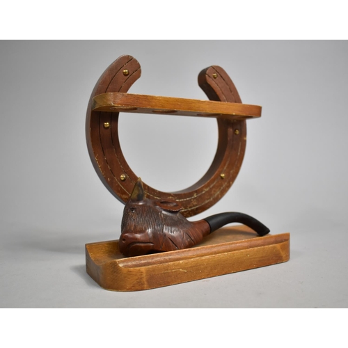 39 - A Mid 20th Century Pipe Rack in the Form of Horseshoe Containing One Carved Bull's Head Pipe