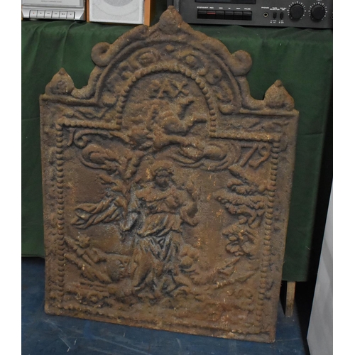 489 - A Cast Iron Moulded Fire Back Inscribed 'Pax 1679', 58cm wide and 80cm high