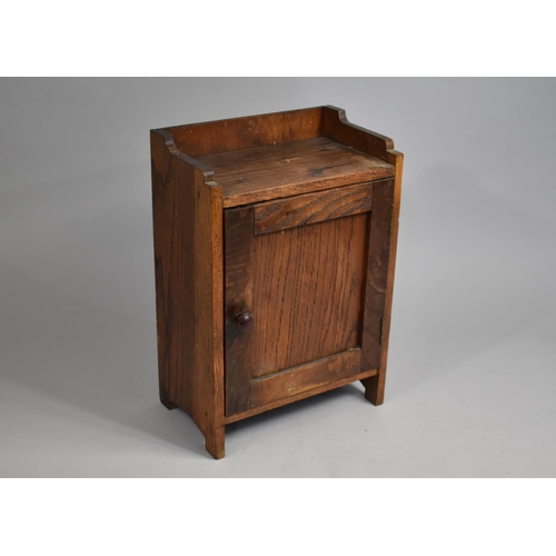 49 - An Edwardian Oak Freestanding and Wall Hanging Small Cabinet with Panelled Door, 25cm wide and 37cm ... 