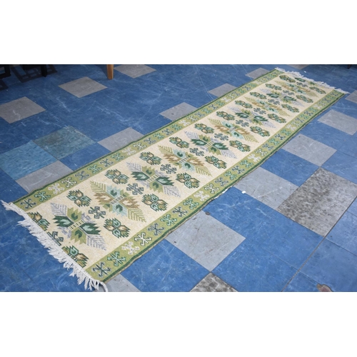 490 - A Woven Runner on Green Ground, 280x76cm