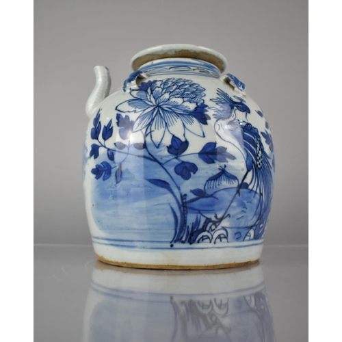 412 - A Chinese Blue and White Teapot decorated with Exotic Bird and Flowers, 19.5cms High