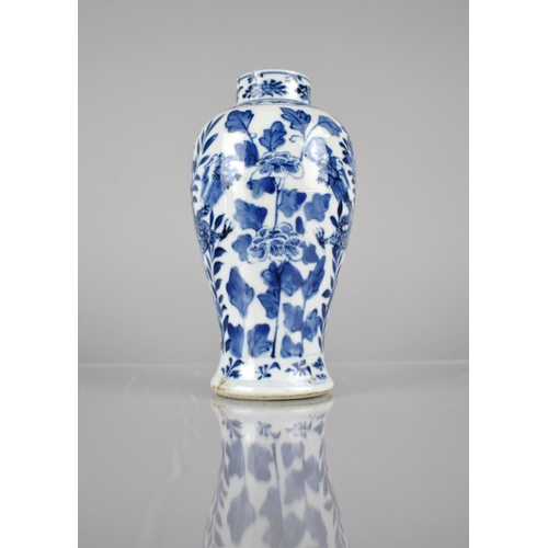 414 - A 19th/20th Century Chinese Porcelain Blue and White Baluster Vase decorated with Dragons Amongst Fl... 