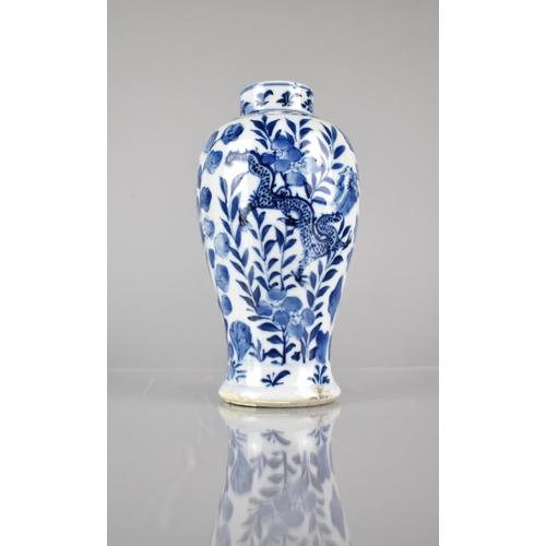 414 - A 19th/20th Century Chinese Porcelain Blue and White Baluster Vase decorated with Dragons Amongst Fl... 