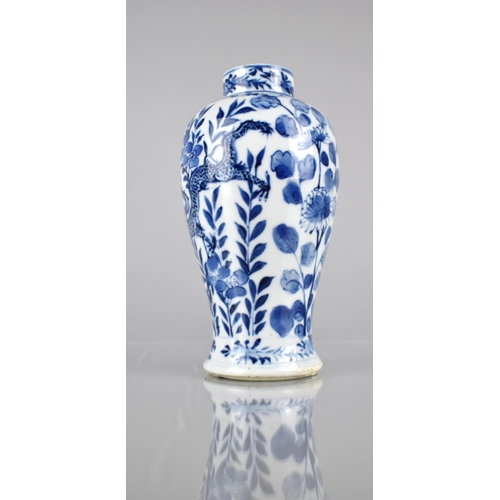 414 - A 19th/20th Century Chinese Porcelain Blue and White Baluster Vase decorated with Dragons Amongst Fl... 