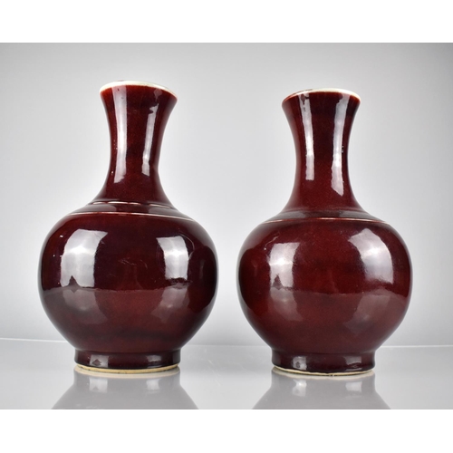 427 - A Pair of Chinese Sang De Boeuf Vases, 34cm high