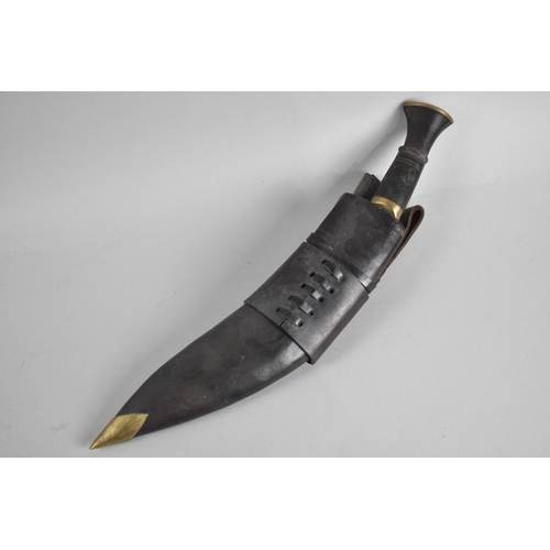 105 - A Vintage Kukri Knife with Leather Scabbard Complete with Two Daggers, Leather Frog