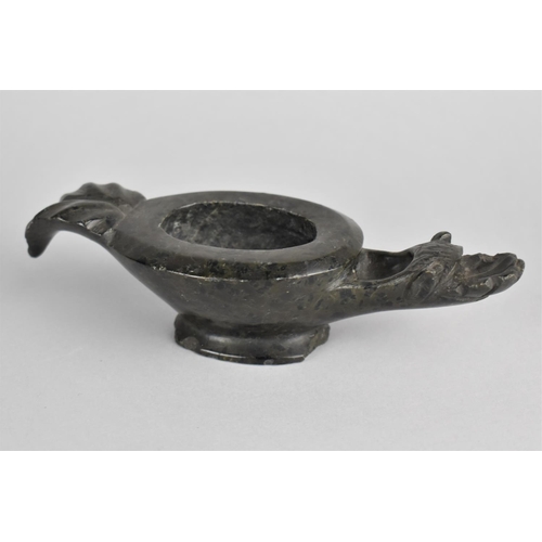 11 - A Carved Polished Stone Oil Lamp with Dragons Head Spout, Some Chips to Base Tail and Spout