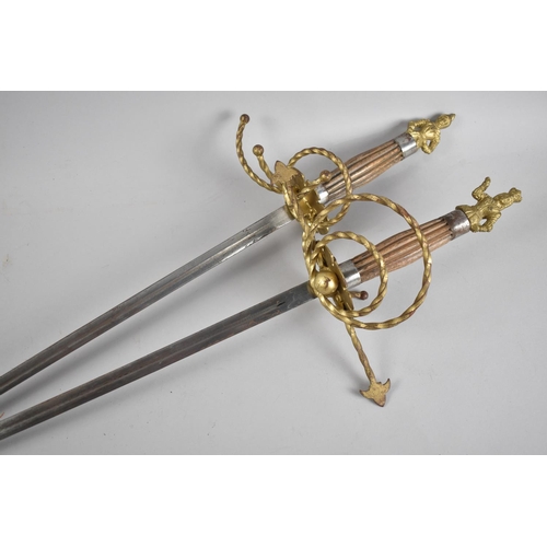 110 - A Pair of Ornamental Gilt Decorated Swords with King and Queen Finials, Each 106cms Long