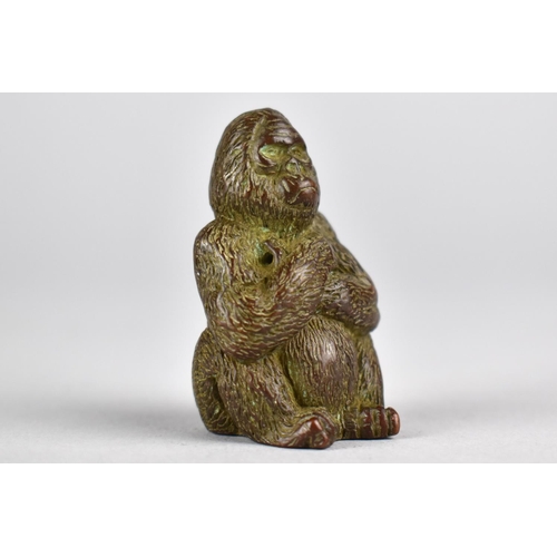 12 - A Small Signed Japanese Bronze Study of a Seated Gorilla with Arms Folded, 4cms High