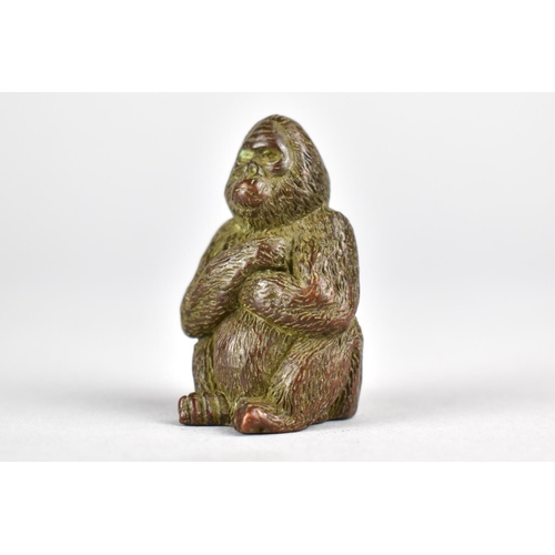 12 - A Small Signed Japanese Bronze Study of a Seated Gorilla with Arms Folded, 4cms High