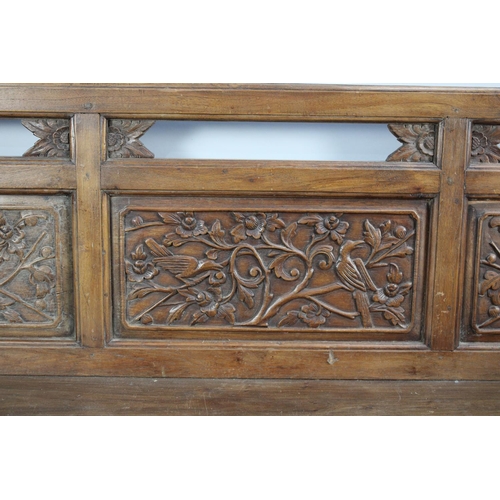 149 - A Chinese Carved Hardwood Settle with Carved and Pierced Panel Back with Birds in Branches Decoratio... 