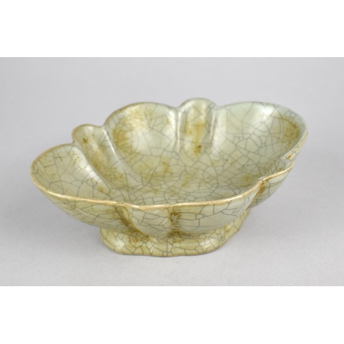 245 - A Reproduction Chinese Celadon Glazed Dish of Reeded Oval Form, 15.5cm wide