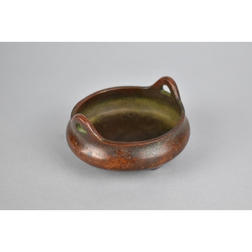 256 - A Small Reproduction Chinese Bronze Censer of Squat Form with Lug Handles, Raised on Tripod Supports... 