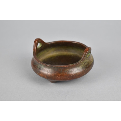 256 - A Small Reproduction Chinese Bronze Censer of Squat Form with Lug Handles, Raised on Tripod Supports... 