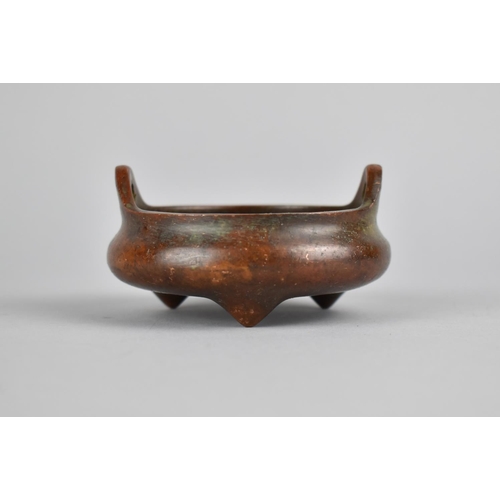 256 - A Small Reproduction Chinese Bronze Censer of Squat Form with Lug Handles, Raised on Tripod Supports... 