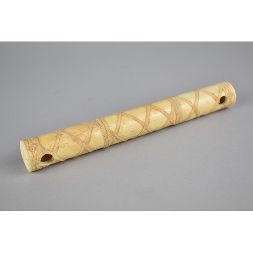 266 - A Reproduction Bone Cylinder Rope Decoration, 19.5cm long