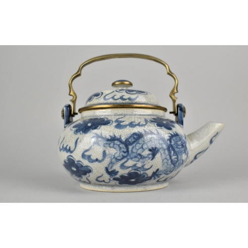 270 - A Reproduction Chinese Blue and White Teapot with Brass Loop Handle