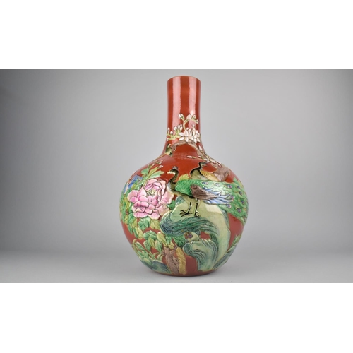 272 - A 20th Century Chinese Bottle Vase Decorated in Relief with Peacocks and Flowers on Red Ground, Seal... 