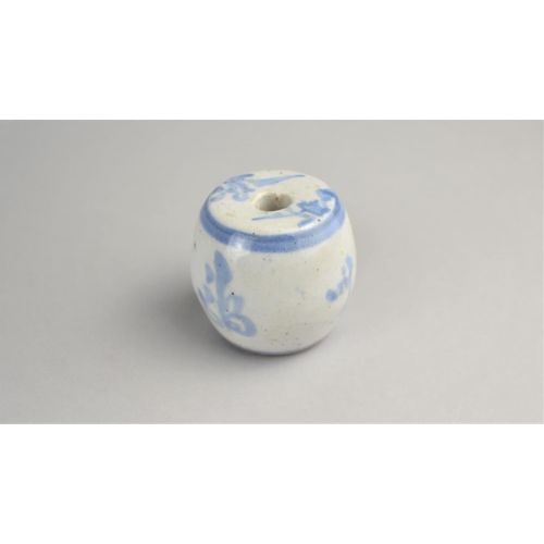 279 - A Chinese Terracotta Blue and White Glazed Incense Stick Holder of Barrel Form, 5cm high