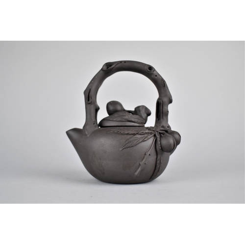 283 - A Chinese Yixing Teapot with Stylised Handle and Applied Decoration, Seal Mark to Base