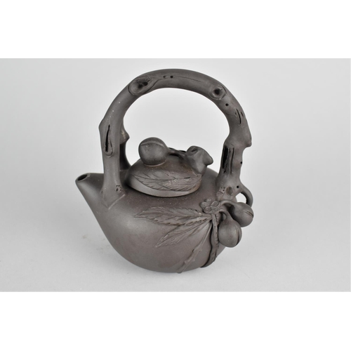 283 - A Chinese Yixing Teapot with Stylised Handle and Applied Decoration, Seal Mark to Base