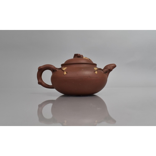 284 - A Late 19th Century Yixing Teapot of Shaped Form with Stylised Handle in the Form of Entwined Vines ... 