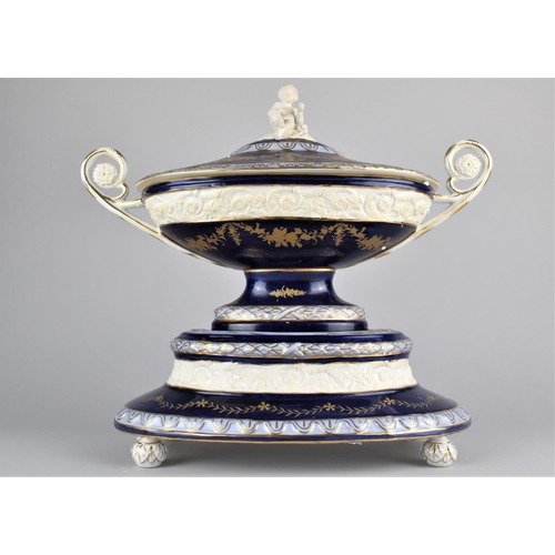 366 - A Reproduction Porcelain Tureen and Cover with Twin Handle and Cherub Finial