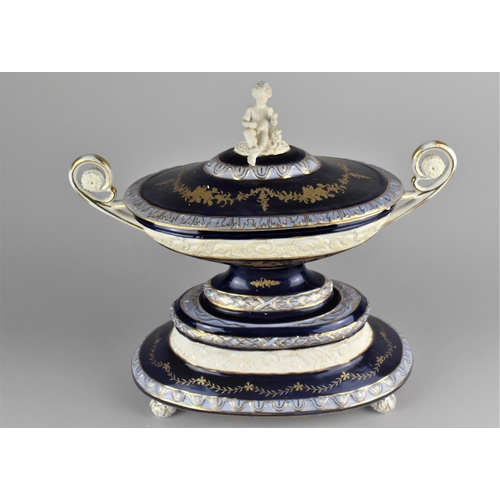 366 - A Reproduction Porcelain Tureen and Cover with Twin Handle and Cherub Finial