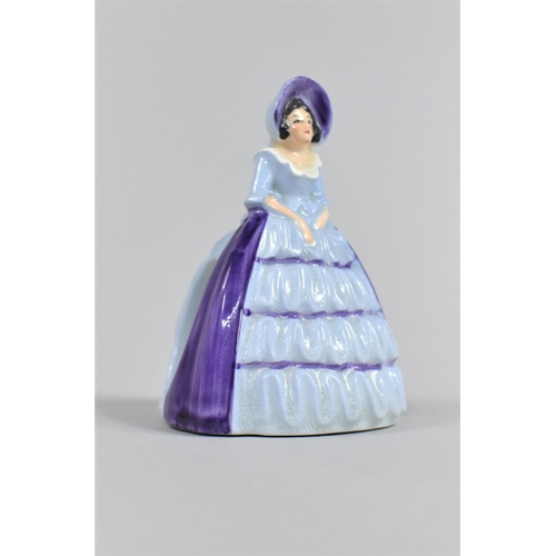 368 - A Carlton Ware Napkin Ring in the Form of a Lady in Ruffled Blue Dress, 10cm high