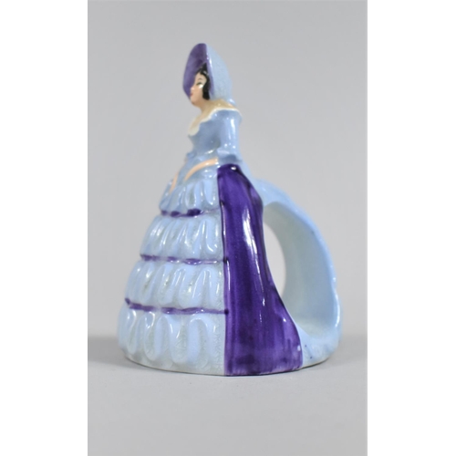 368 - A Carlton Ware Napkin Ring in the Form of a Lady in Ruffled Blue Dress, 10cm high