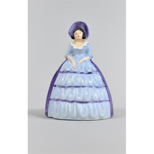 368 - A Carlton Ware Napkin Ring in the Form of a Lady in Ruffled Blue Dress, 10cm high