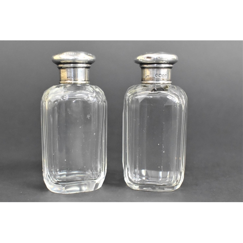 385 - A Pair of Silver Topped Glass Dressing Table Scent Bottles, Hallmark for London 1876 by T.W. (Thomas... 